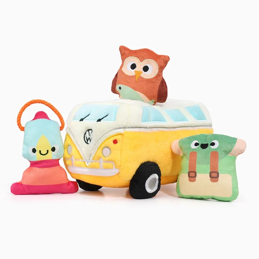 Yellow plush VW camper bus with a lantern, owl and backpack toy