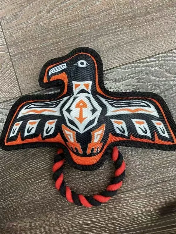 Thunderbird tug toy in black, orange and white with a red and black rope ring